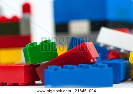 Colorful play construction bricks close up shot.