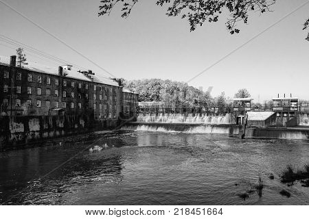 Prattville Alabama USA - December 9 2017: Historic Pratt Cotton Gin Company and spillway in downtown Prattville after a rare snow storm.