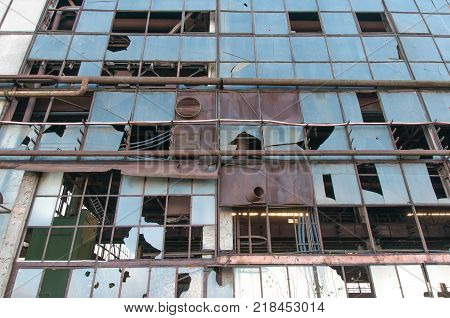 Old, abandoned factory, broken glass, in Brasov , Romania.