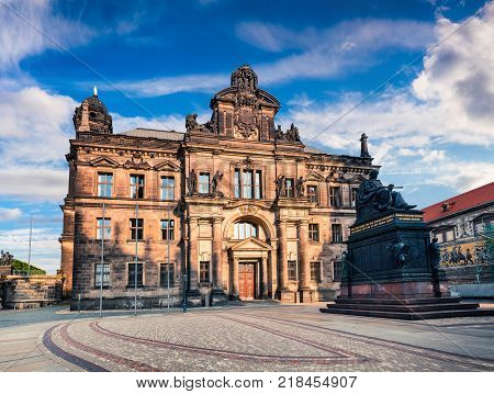 Sunny cityscape of Dresden with Court of Appeal and statue of Frederick Augustus. Summer morning in capital of Saxony Germany Europe. Artistic style post processed photo.