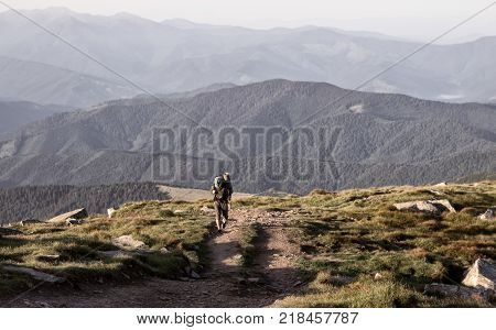 Man in the mountians the man is hikking in the mountians