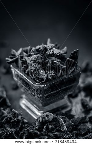 Close Up Star Aniseed,illicium Verum In A Bowl With Powder.