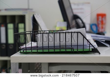 Document tray with document white paper on desk in office. Business office concept.