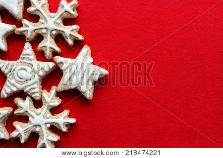 Christmas pastries the gingerbread cookie in the shape of stars and snowflakes food isolated on red background