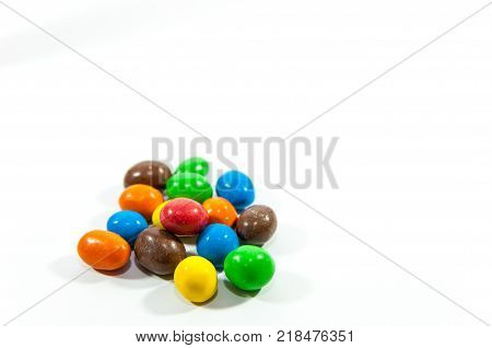 Colorful, popular peanuts with sugar glazure isolated on white background.