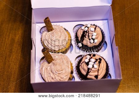 a gift box of four delicious homemade cupcakes