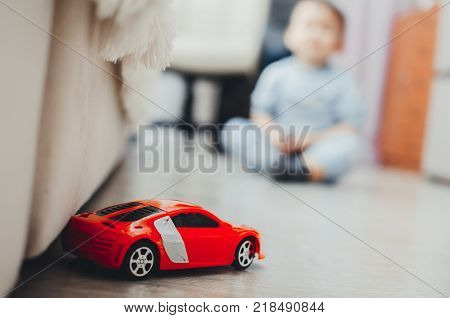The Child Remote Controls Red Machine