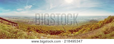 Panoramic view of the Nitra city from Zobor hill Slovak republic. Seasonal landscape. Autumn forest. Tourism theme. Yellow photo filter.