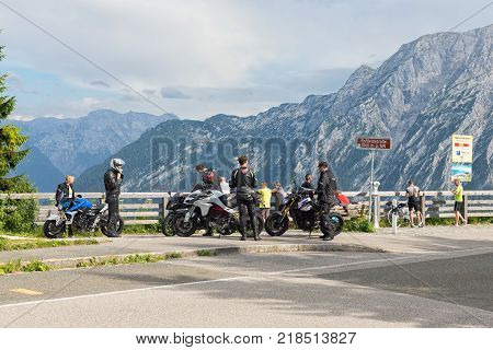 BERCHTESGADEN, GERMANY - JULY 08, 2017: Motorcyclists at car park Rossfeld panorama road over the mountain ridge between Germany and Austria
