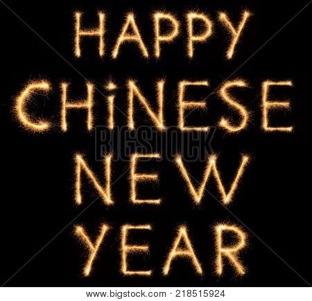 HAPPY CHINESE NEW YEAR lettering drawn with bengali sparkles isolated on black background