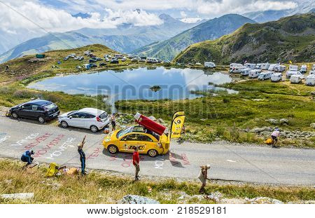 Col de la Croix de Fer France - 25 July 2015: BIC caravan driving on the road to the Col de la Croix de Fer in Alps during the stage 20 of Le Tour de France 2015. BIC is a global company which offers an extensive line of writing and office tools.