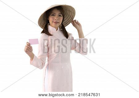 beautiful woman in pink dress and vietnam hat holding business card. isolated background with clipping path.