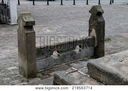 The old stocks in Market Square in the small village of Standish in Wigan