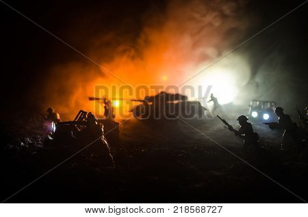Tank Under The Snow At Night In Forest At Conflict Zone. Silhouette Of Military Tank. War Military C
