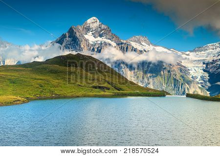 Wonderful Bachalpsee mountain lake with high mountains and snowy peaks in background Grindelwald Bernese Oberland Switzerland Europe