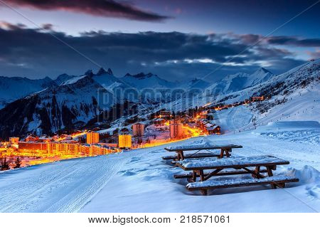 Majestic winter sunrise landscape and ski resort with resting place in French Alps, La Toussuire, France, Europe