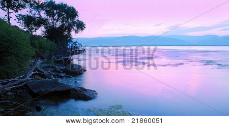 Sunrise On Riverbank