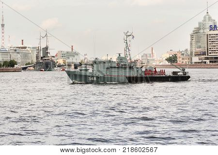 St. Petersburg, Russia - 28 July, Minesweeper in front of the Aurora, 28 July, 2017.
Festive parade of warships on the Neva River in St. Petersburg.