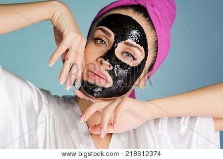 an attractive young girl with a pink towel on her head, a chena cleansing mask on her face