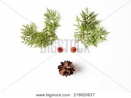 Reindeer Face from natural materials. Christmas deer silhouette picture in minimalistic design concept