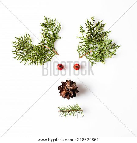 Reindeer Face from natural materials. Christmas deer silhouette picture in minimalistic design concept