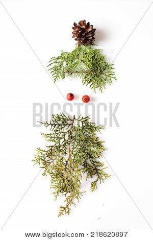 Gnome or elf face from natural materials. Christmas silhouette picture in minimalistic design concept