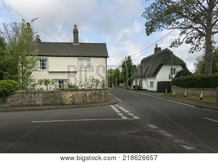 Street view of old cottages in the pretty village of Fowlmere Cambridgeshire England UK