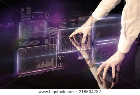 Male hands touching interactive table with purple cloudspace graphic on it 