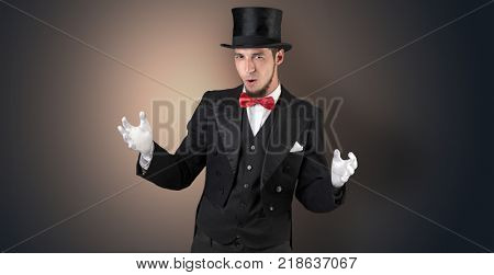 Handsome magician with no graph holds something invisible