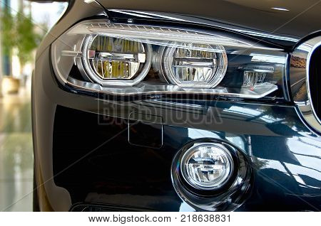 Headlight. Front Car detail. The front lights of the luxury car. transport concept - close up.