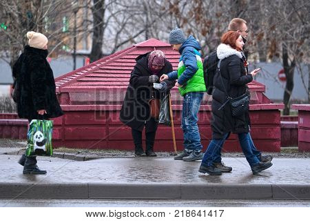 Moscow, Russia - December, 17, 2017: begger stands on Moscow street