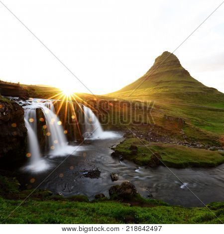 Colorful sunrise on Kirkjufellsfoss waterfall. Amazing morning scene near Kirkjufell volkano, Iceland, Europe. Landscape photography