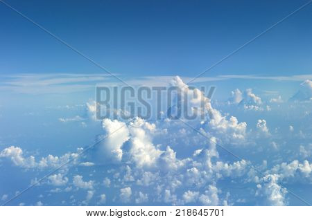 View at Clods on the Sky from the window of an aiplane. Skyscape viewed from airplane.