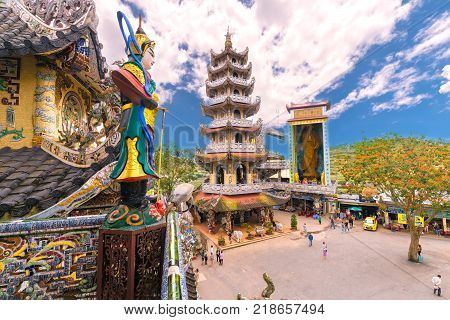 Lam Dong, Vietnam - November 28th, 2017: Beauty Pagoda architecture with monumental associated pylons from millions pieces crockery create composite shapes attract Buddhist in Lam Dong, Vietnam