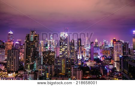 The buildings in Bangkok night city purple sky