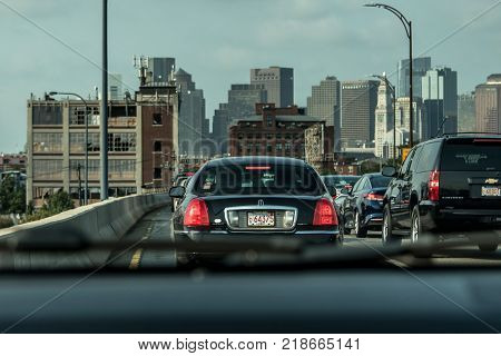 Boston, MA, USA 05.09.2017 - Skyscrapers Skyline with daily car traffic on the road