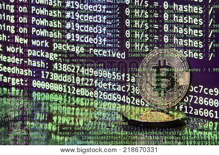 Image of the program code showing the process of mining the crypto currency in the background of the image with bitcoin