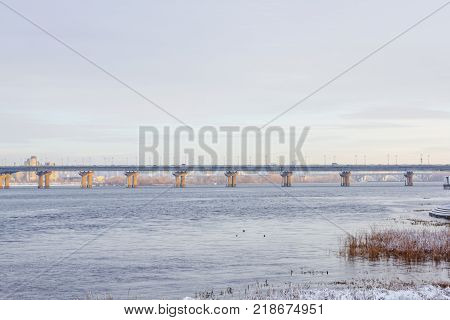 View of the Dnieper in winter. Kiev, Ukraine. Paton bridge