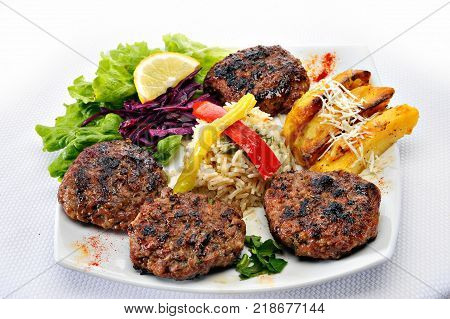 Greek Burger Plate	with rice and fried potatoes