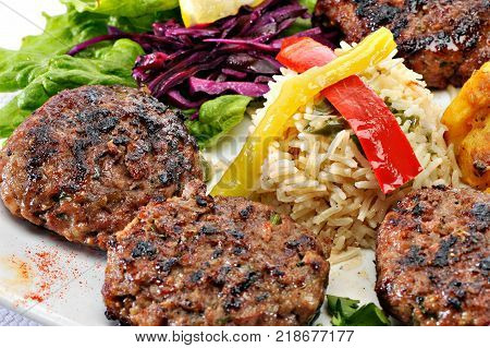 Greek Burger Plate	with rice and fried potatoes