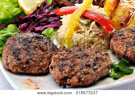 Greek Burger Plate	with rice and fried potatoes