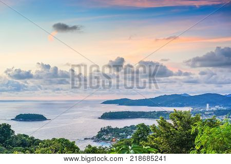 Landscape with sea beaches tropical greenery at sunset on the background of blue sky with picturesque clouds. The view from the observation platform of the island of Phuket Thailand