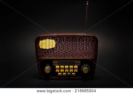 Vintage retro look MP3 player on isolated Black Background. Good Old Memories Radio Transistor in present day. Low Key Photography