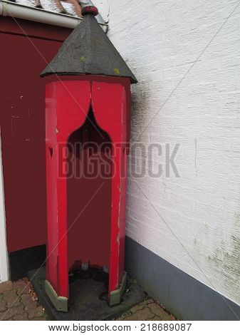 Small wooden guard house standing empty in corner of car park in Graasten Southern Denmark