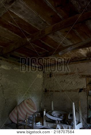 old attic with wooden ceiling and scattered knick knack
