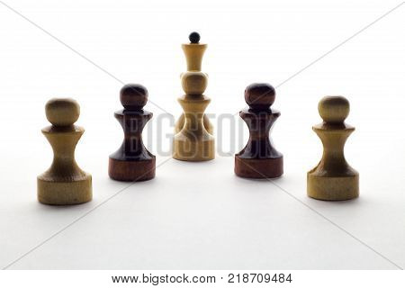 black and white chess pawns and queen on a white background