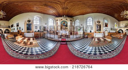 GNEZNO BELARUS - JULY 26 2016: Panorama interior of basilica near the organ with view of the altar. Full spherical 360 by 180 degrees seamless panorama in equirectangular projection. VR content