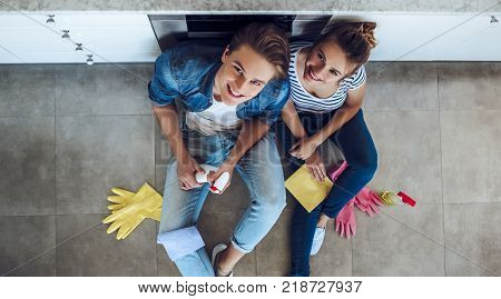 Couple Is Doing Cleaning At Home