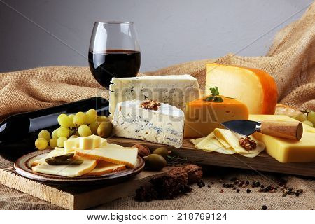 various types of cheese on rustic wooden table