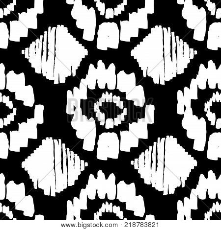 A repeating floral black and white pattern painted with a brush.